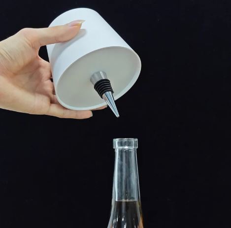 Whacky Wino wine bottle lamp with a glowing light inside, showcasing a sleek glass bottle design suitable for home decor.
