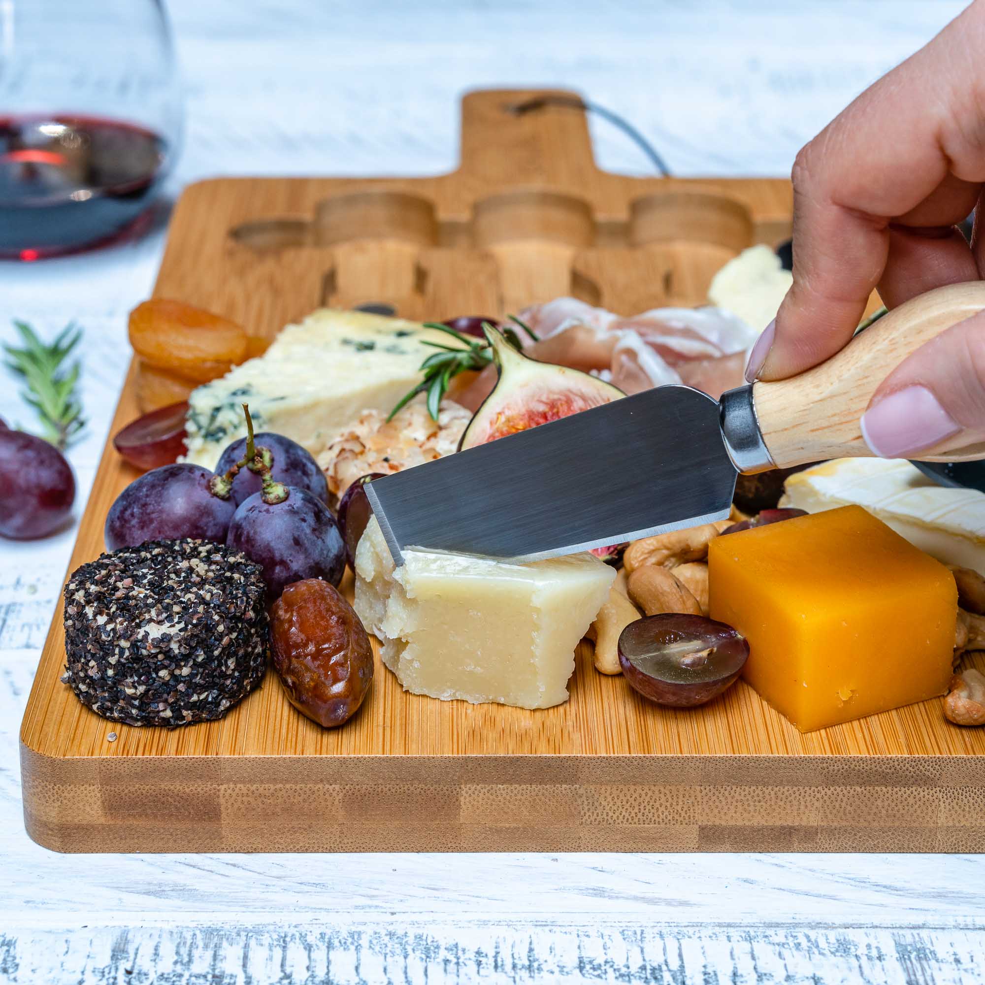 Whacky Wino bamboo charcuterie board, 12x8 inches with magnetic cutlery storage and space for cheeses, meats, and snacks.