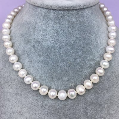 Natural freshwater pearl necklace by Whacky Wino featuring a string of lustrous white pearls on a delicate chain.