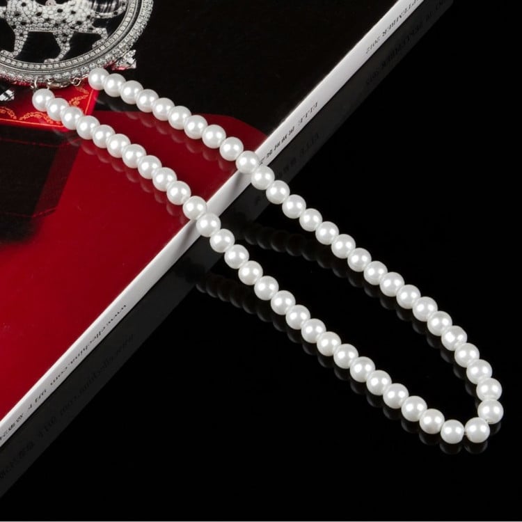 Natural freshwater pearl necklace from Whacky Wino featuring lustrous white pearls on a delicate chain.