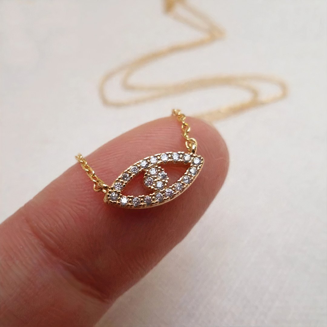 18K gold Abby necklace featuring a delicate chain and pendant, crafted by Whacky Wino, displayed on a neutral background.