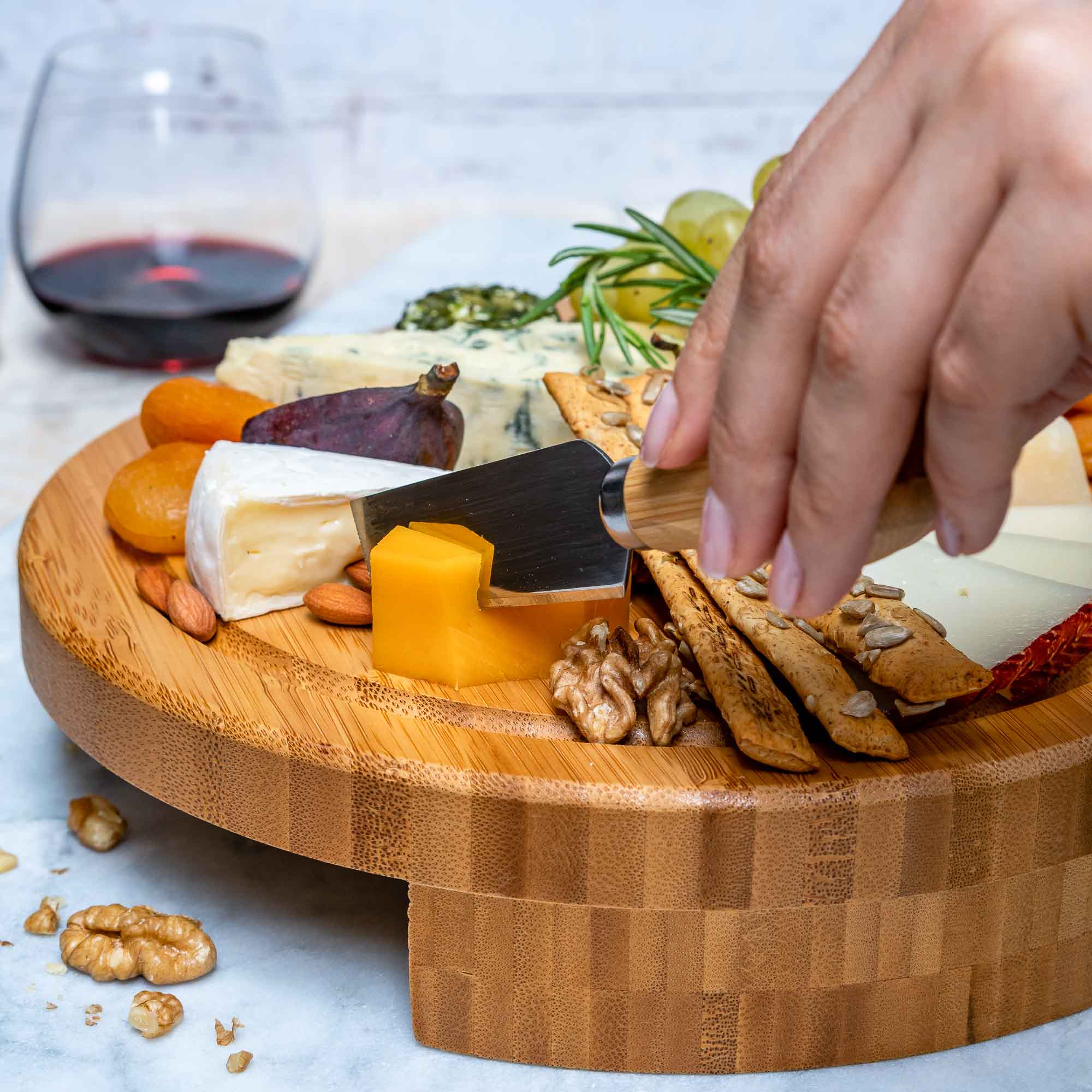 Whacky Wino 10-inch bamboo swivel charcuterie board with slide-out drawer for serving cheeses and snacks.