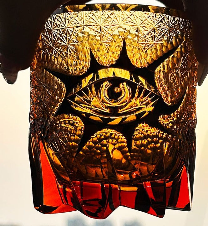Handmade Crystal God's Eye wine glass by Whacky Wino featuring a colorful, intricate crystal design on clear glass.
