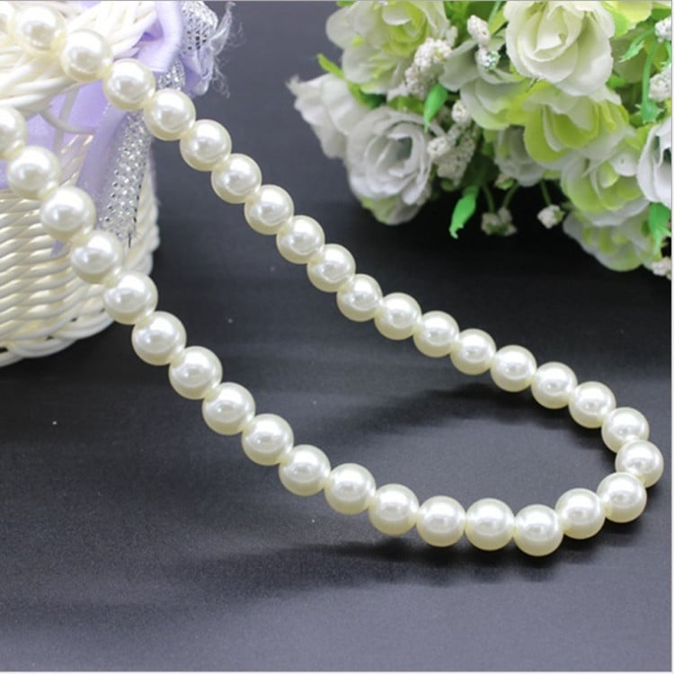 Natural freshwater pearl necklace by Whacky Wino featuring lustrous white pearls on a delicate strand.