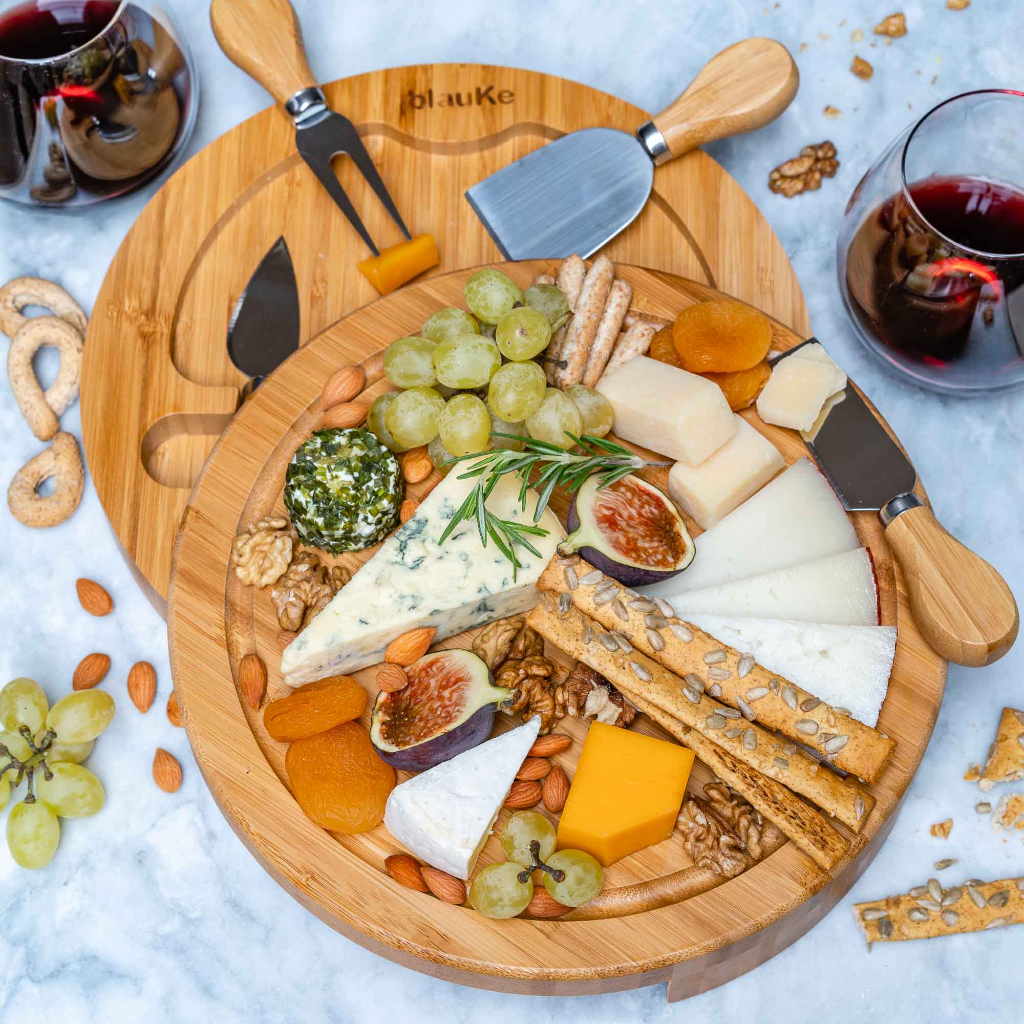 Whacky Wino 10-inch bamboo Swivel Board with slide-out drawer for serving charcuterie and appetizers.